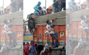 A tragic photo of migrant workers telangana to jarkhand a boy lift baby to truck